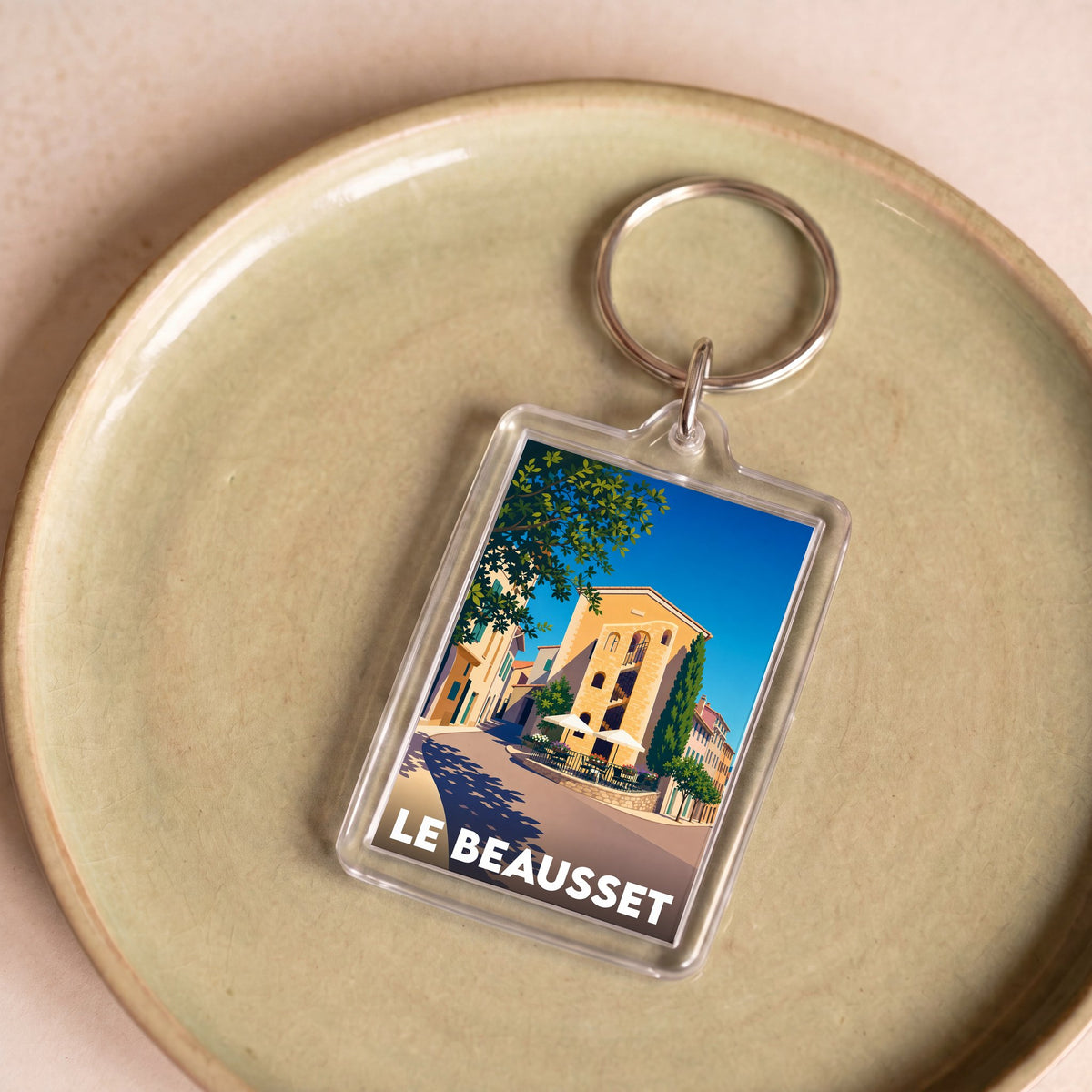 Porte-clés souvenir de la ville du Beausset avec une illustration stylisée.