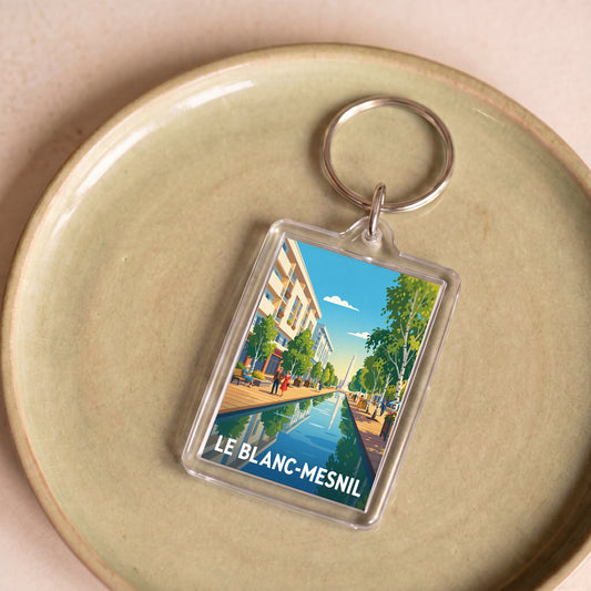 Porte-clés souvenir de la ville de Le Blanc-Mesnil avec une illustration stylisée.