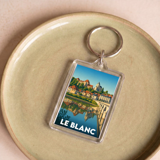 Porte-clés souvenir de la ville de Le Blanc avec une illustration stylisée et colorée.