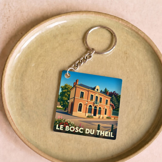 Porte-clés souvenir de la ville de Le Bosc du Theil avec une illustration stylisée.