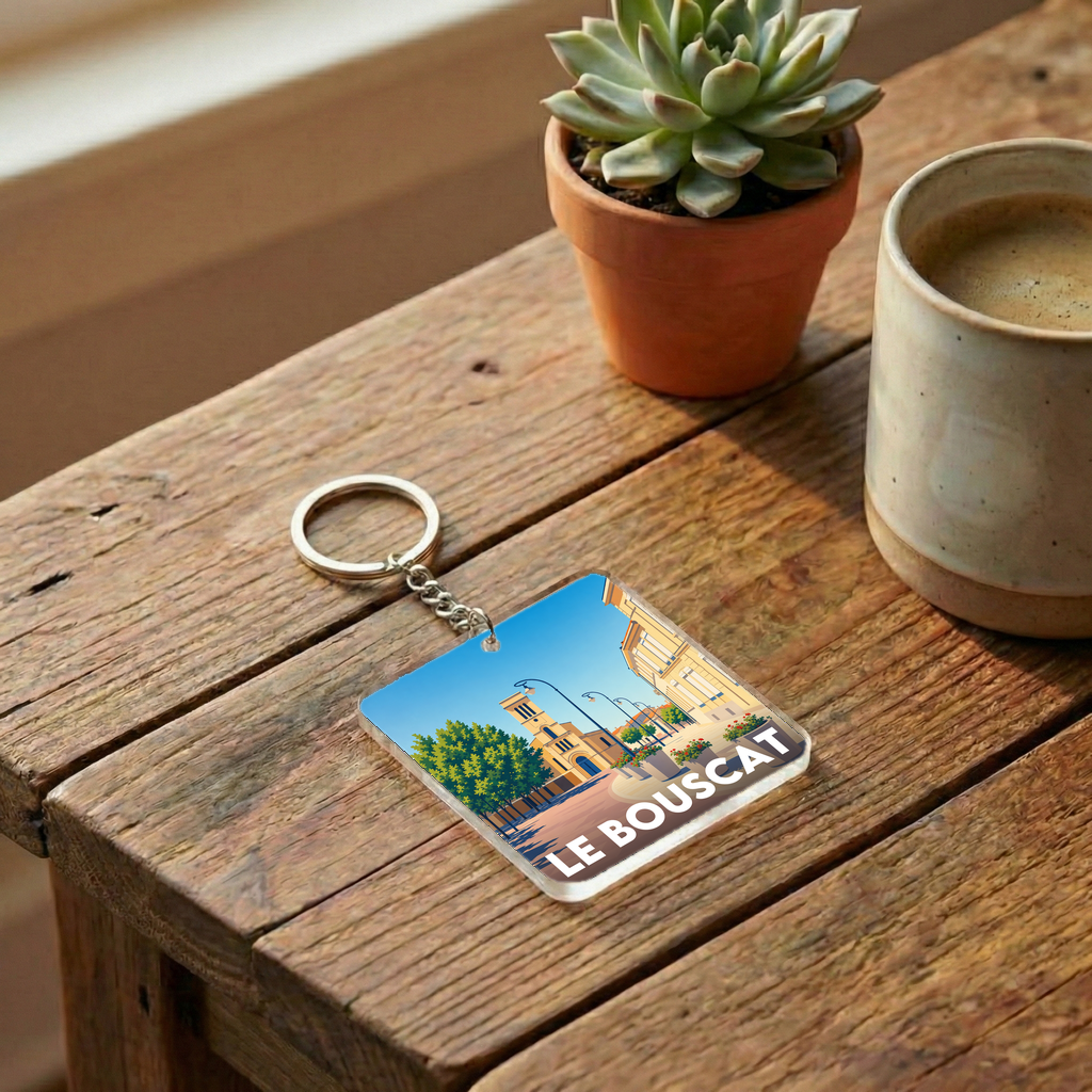 Porte-clés souvenir de la ville de Le Bouscat avec une illustration stylisée.