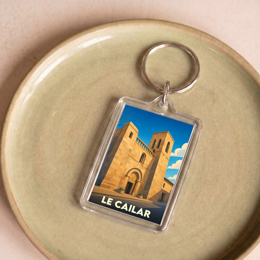 Porte-clés souvenir de la ville de Le Cailar avec une illustration stylisée de son église.