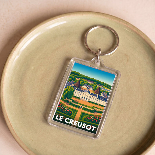 Porte-clés souvenir de la ville de Le Creusot avec une illustration stylisée.