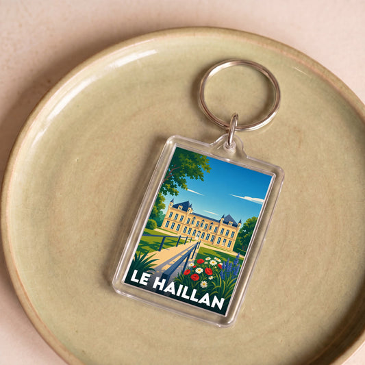 Porte-clés souvenir de la ville de Le Haillan avec une illustration stylisée du château.