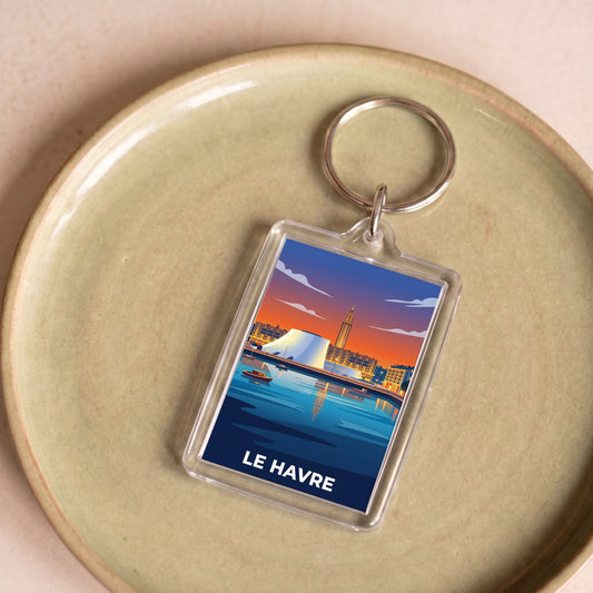 Porte-clés souvenir de la ville du Havre avec une illustration stylisée.