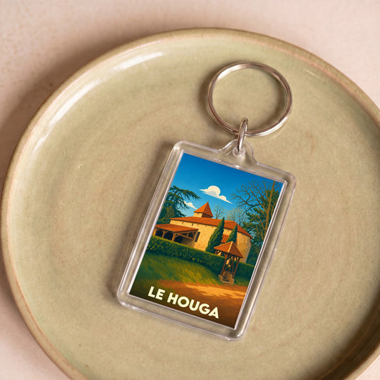 Porte-clés souvenir de la ville de Le Houga avec une illustration stylisée.
