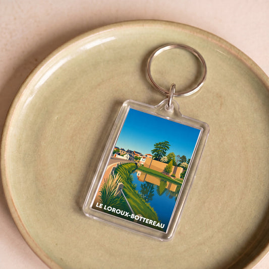 Porte-clés souvenir de la ville du Loroux-Bottereau avec une illustration stylisée.