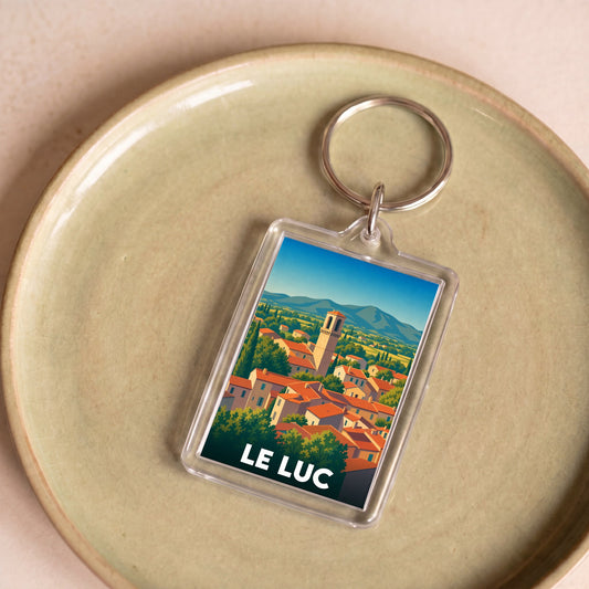 Porte-clés souvenir de la ville de Le Luc avec une illustration stylisée.