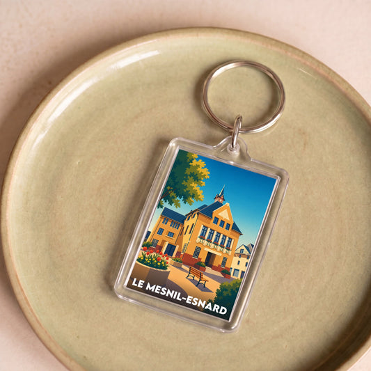 Porte-clés souvenir de la ville de Le Mesnil-Esnard avec une illustration stylisée.