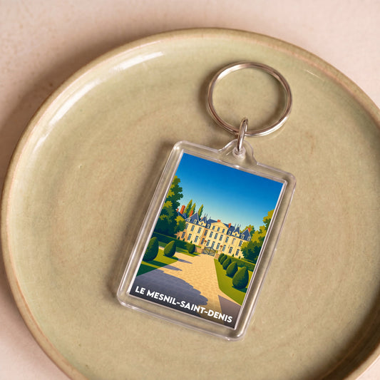 Porte-clés souvenir de la ville de Le Mesnil-Saint-Denis avec une illustration stylisée de son château.