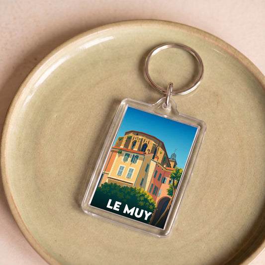 Porte-clés souvenir de la ville de Le Muy avec une illustration stylisée et colorée.