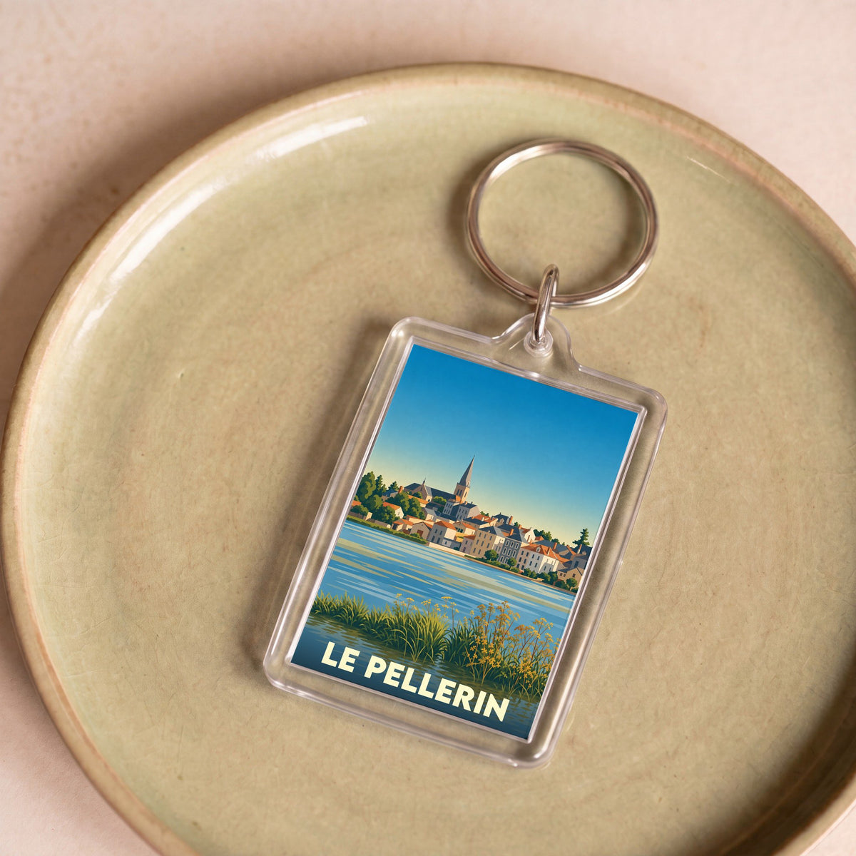 Porte-clés souvenir de la ville du Pellerin avec une illustration stylisée.