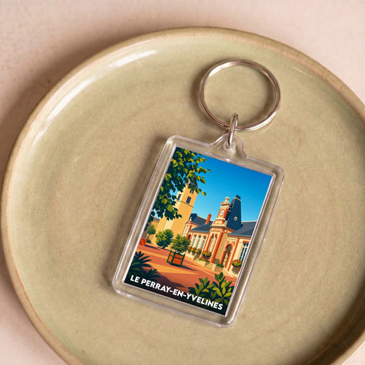 Porte-clés souvenir de la ville de Le Perray-en-Yvelines avec une illustration colorée et stylisée de l'hôtel de ville.
