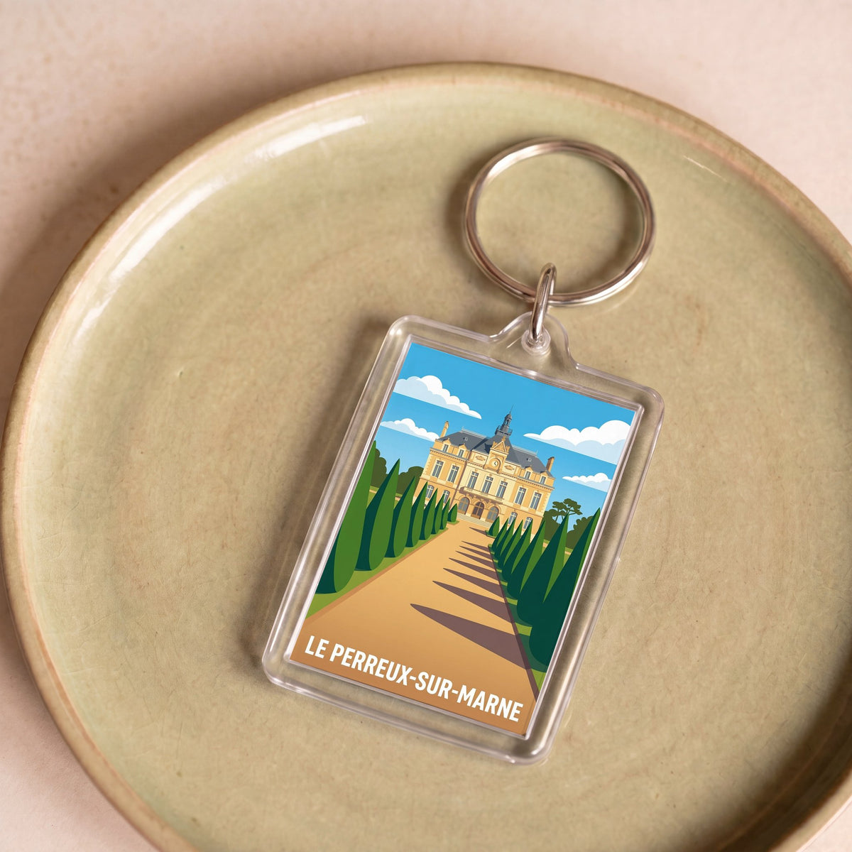 Porte-clés souvenir de la ville de Le Perreux-sur-Marne avec une illustration stylisée.