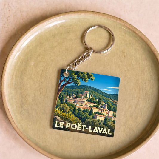 Porte-clés souvenir de la ville du Poët-Laval avec une illustration stylisée.