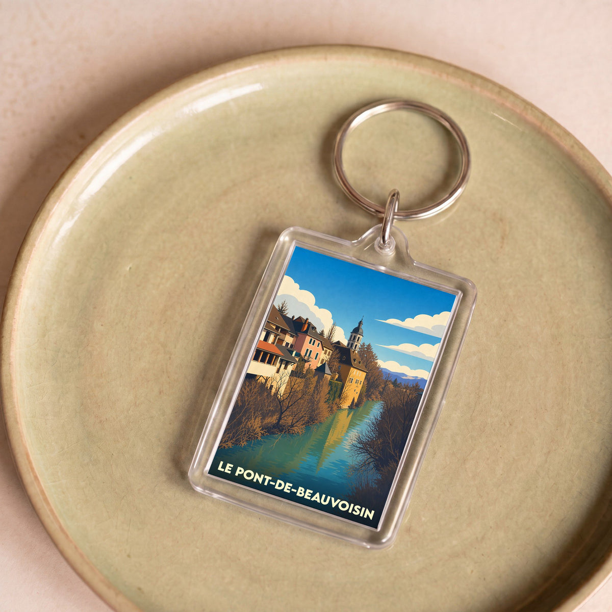 Porte-clés souvenir de la ville de Le Pont-de-Beauvoisin avec une illustration stylisée.