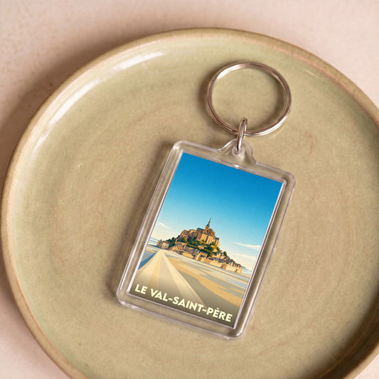 Porte-clés souvenir de la ville de Le Val-Saint-Père avec une illustration stylisée du Mont-Saint-Michel.
