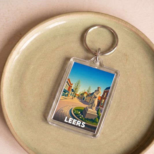 Porte-clés souvenir de la ville de Leers avec une illustration stylisée.