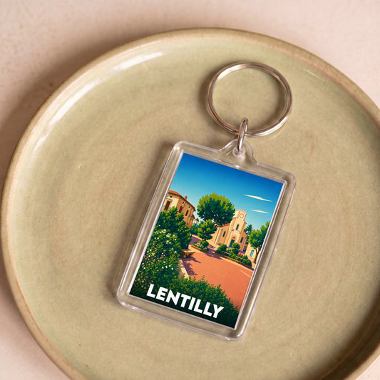 Porte-clés souvenir de la ville de Lentilly avec une illustration stylisée.