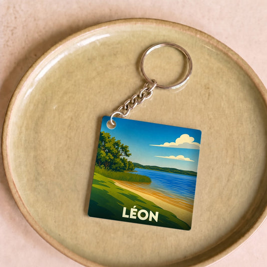 Porte-clés souvenir de la ville de Léon avec une illustration stylisée de son lac.