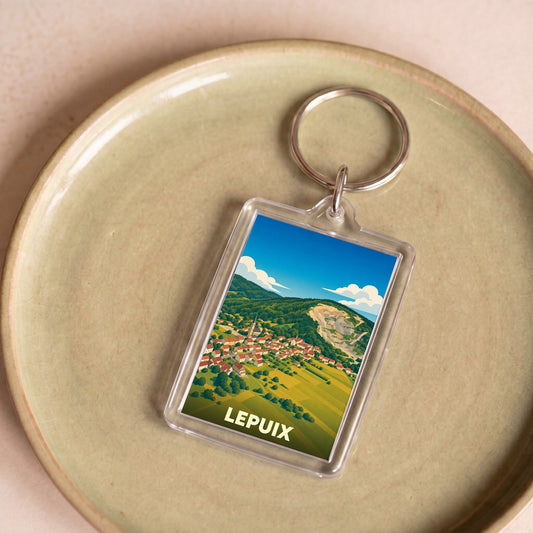 Porte-clés souvenir de la ville de Lepuix avec une illustration stylisée.