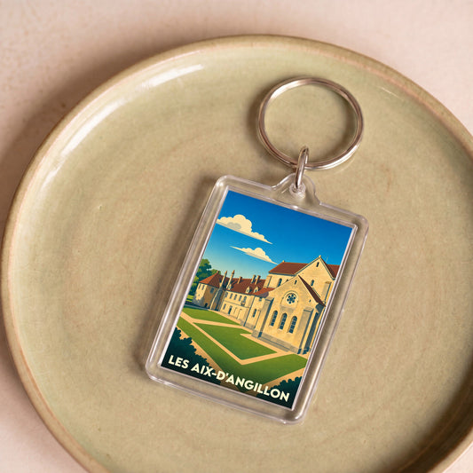 Porte-clés souvenir de la ville de Les Aix-d'Angillon avec une illustration stylisée.