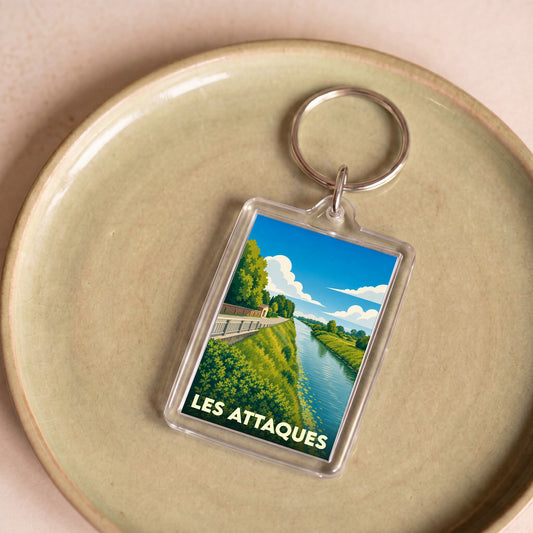 Porte-clés souvenir de la ville de Les Attaques avec une illustration stylisée.