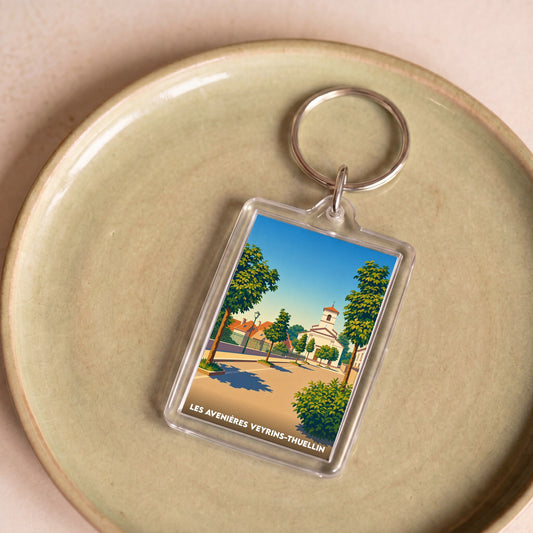 Porte-clés souvenir de la ville de Les Avenières Veyrins-Thuellin avec une illustration stylisée.