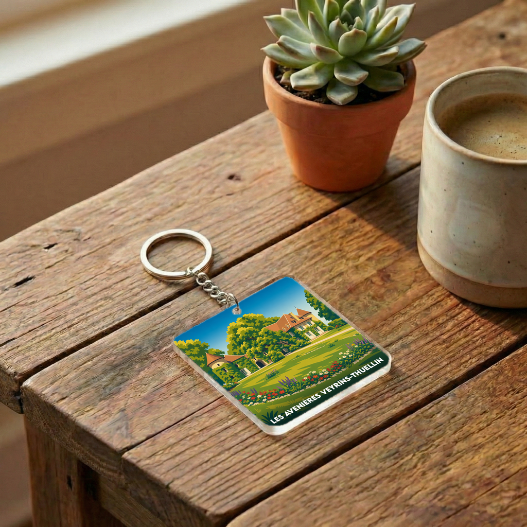 Porte-clés souvenir de la ville de Les Avenières Veyrins-Thuellin avec une illustration stylisée.
