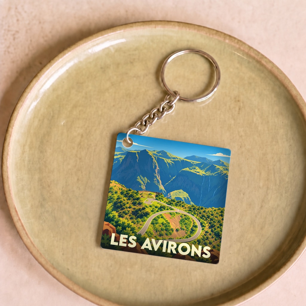 Porte-clés souvenir de la ville de Les Avirons avec une illustration stylisée de paysages montagneux.