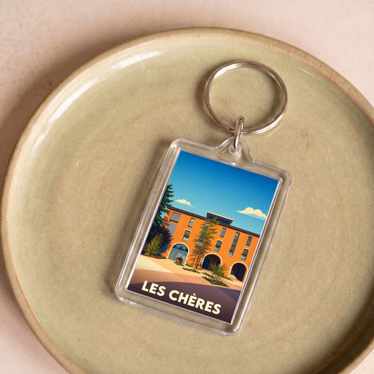 Porte-clés souvenir de la ville de Les Chères avec une illustration stylisée.