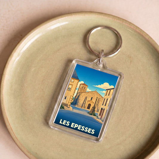 Porte-clés souvenir de la ville de Les Epesses avec une illustration stylisée.