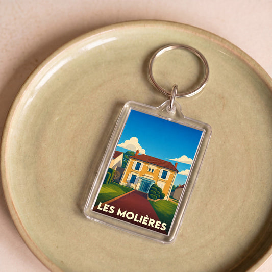 Porte-clés souvenir de la ville de Les Molières avec une illustration stylisée d'une maison.