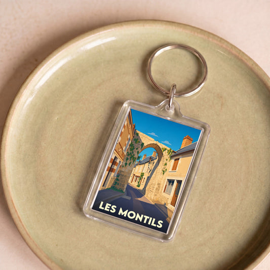 Porte-clés souvenir de la ville de Les Montils avec une illustration stylisée.