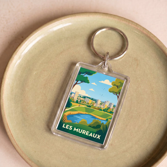 Porte-clés souvenir de la ville de Les Mureaux avec une illustration stylisée.