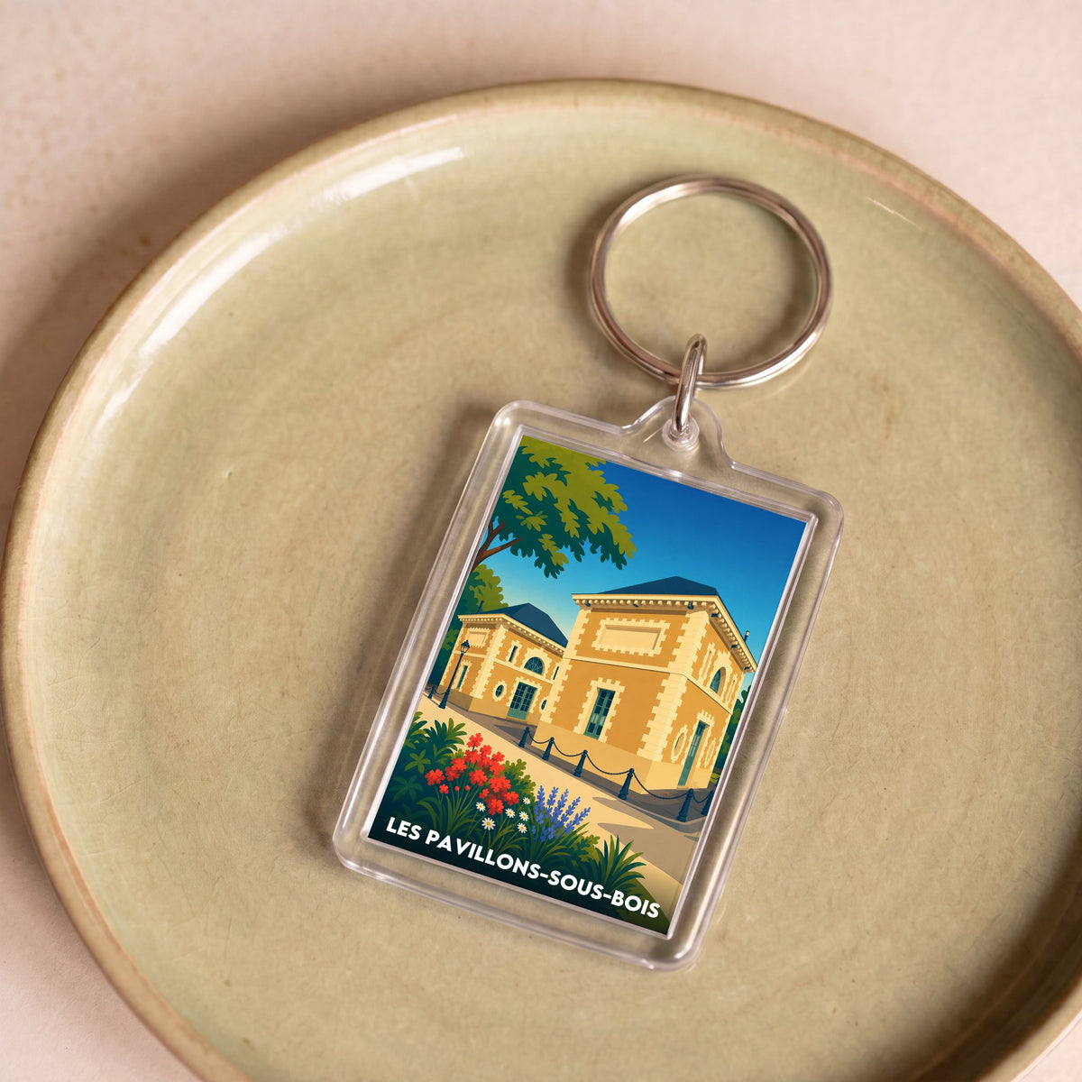 Porte-clés souvenir de la ville de Les Pavillons-sous-Bois avec une illustration stylisée.