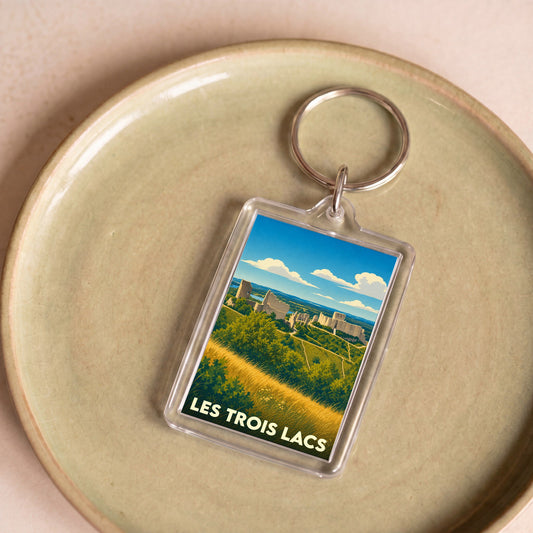Porte-clés souvenir de la ville de Les Trois Lacs avec une illustration stylisée.