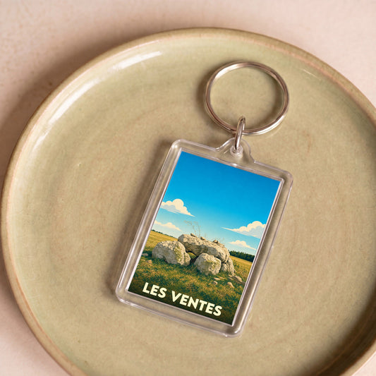 Porte-clés souvenir de la ville de Les Ventes avec une illustration stylisée d'un dolmen.
