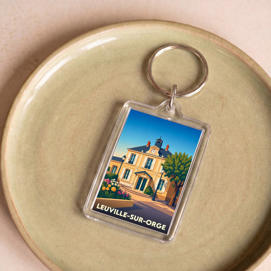 Porte-clés souvenir de la ville de Leuville-sur-Orge avec une illustration stylisée de la mairie.