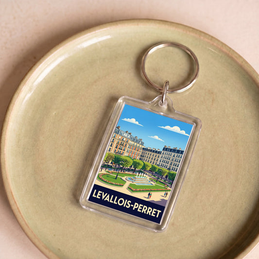 Porte-clés souvenir de la ville de Levallois-Perret avec une illustration stylisée.