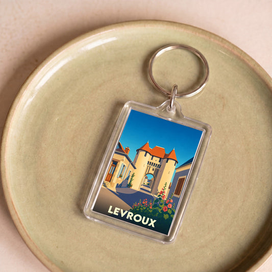 Porte-clés souvenir de la ville de Levroux avec une illustration stylisée de sa porte médiévale.