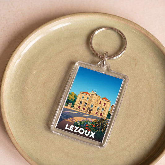 Porte-clés souvenir de la ville de Lezoux avec une illustration stylisée de son hôtel de ville.