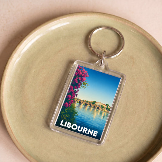 Porte-clés souvenir de la ville de Libourne avec une illustration stylisée d'un pont historique.