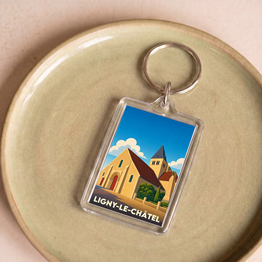 Porte-clés souvenir de la ville de Ligny-le-Châtel avec une illustration stylisée de son église.