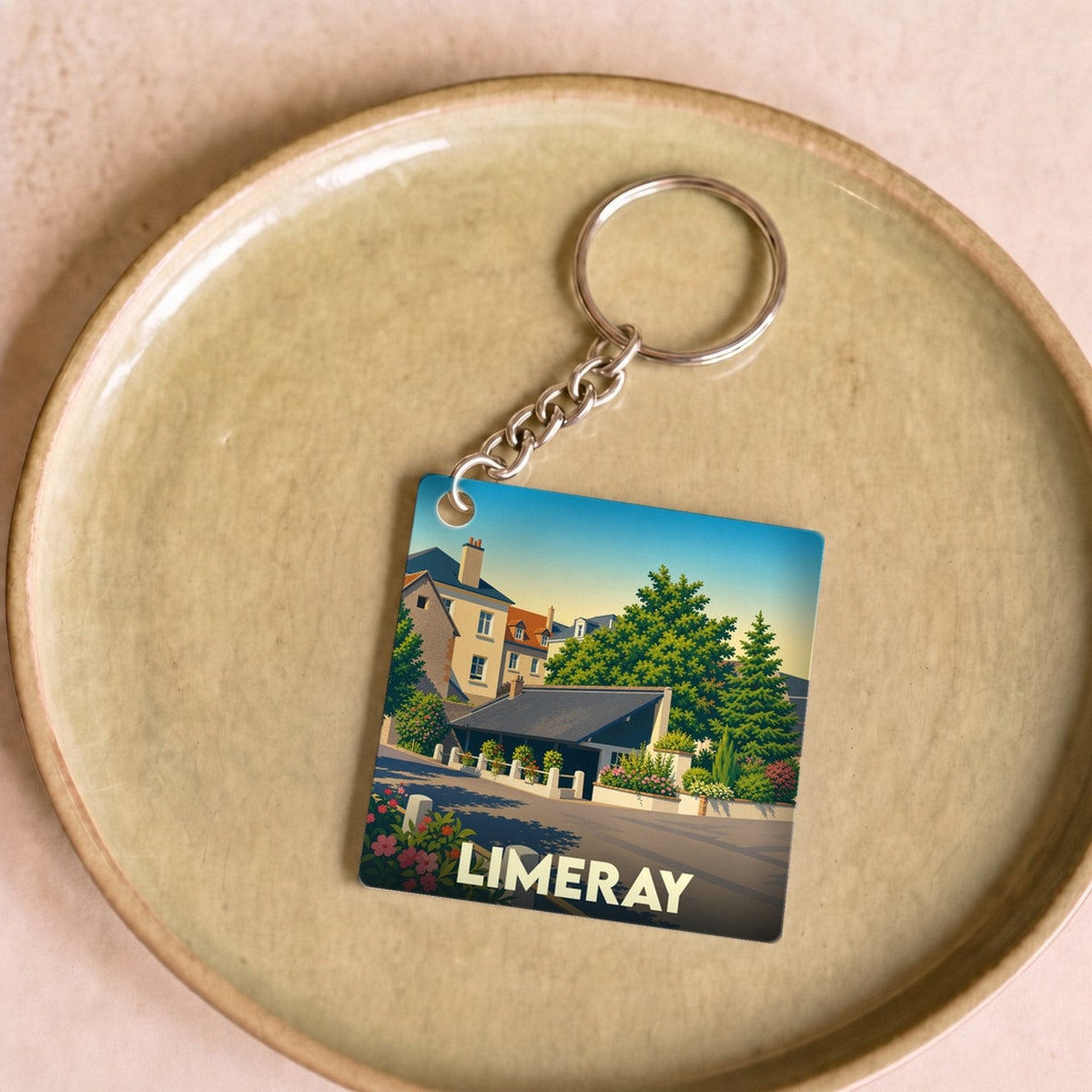 Porte-clés souvenir de la ville de Limeray avec une illustration stylisée.