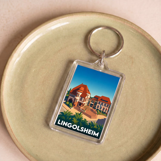 Porte-clés souvenir de la ville de Lingolsheim avec une illustration stylisée.