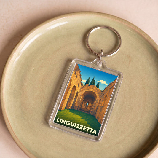 Porte-clés souvenir de la ville de Linguizzetta avec une illustration stylisée d'anciennes ruines corses.
