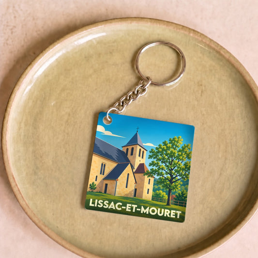 Porte-clés souvenir de la ville de Lissac-et-Mouret avec une illustration stylisée de son église.