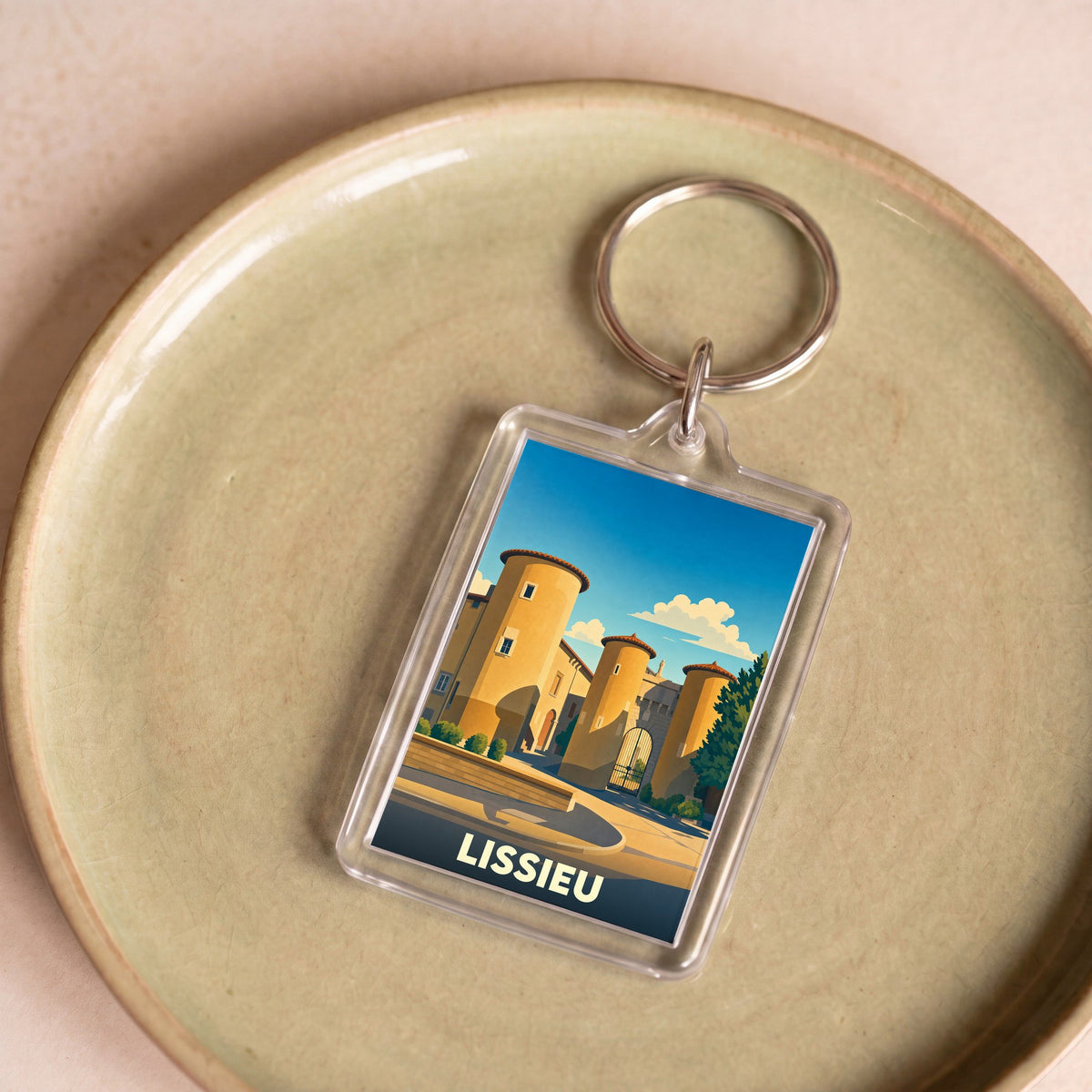 Porte-clés souvenir de la ville de Lissieu avec une illustration stylisée d'un château.