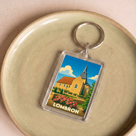 Porte-clés souvenir de la ville de Lombron avec une illustration stylisée de son église.